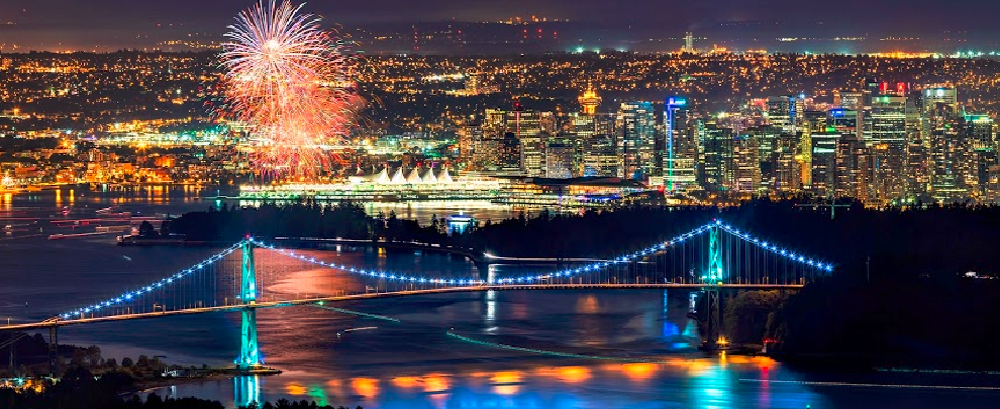Lions Gate Bridge night scene with fireworks from West Vancouver